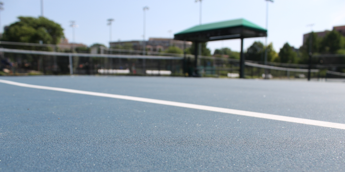 A low angle picture of a tennis court.